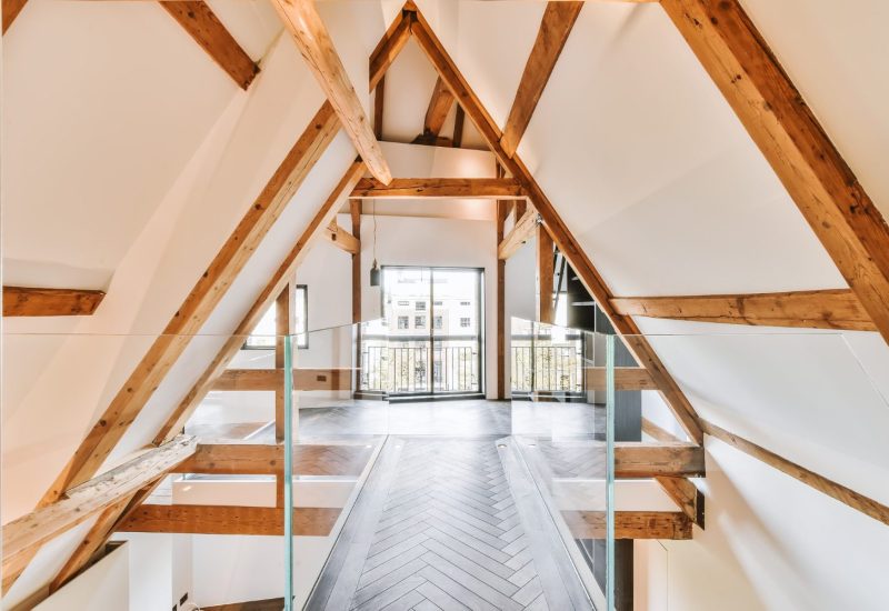 Interior view of loft conversion showing timber A-frame roof structure