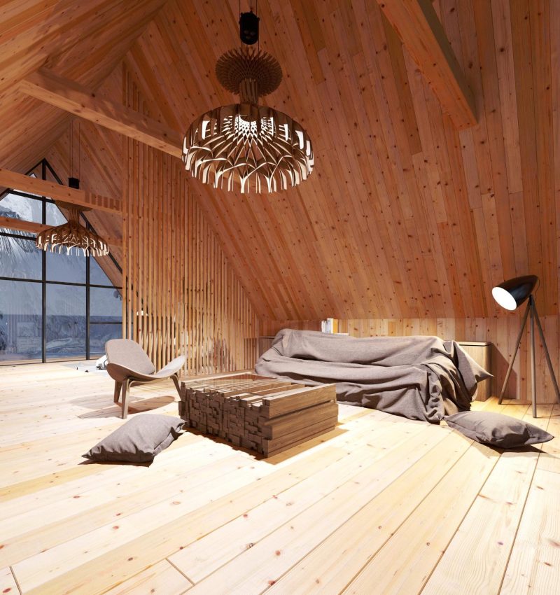 Converted loft bedroom with exposed wooden beams and Velux window
